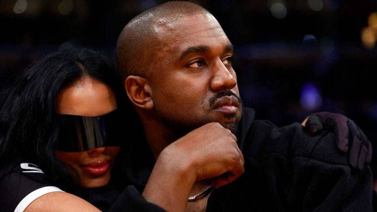 Rapper Kanye West and girlfriend Chaney Jones attend a game between the Washington Wizards and the Los Angeles Lakers in the fourth quarter at Crypto.com Arena on March 11, 2022 in Los Angeles, California. NOTE TO USER: User expressly acknowledges and agrees that, by downloading and/or using this Photograph, user is consenting to the terms and conditions of the Getty Images License Agreement. (Photo by Ronald Martinez/Getty Images)
