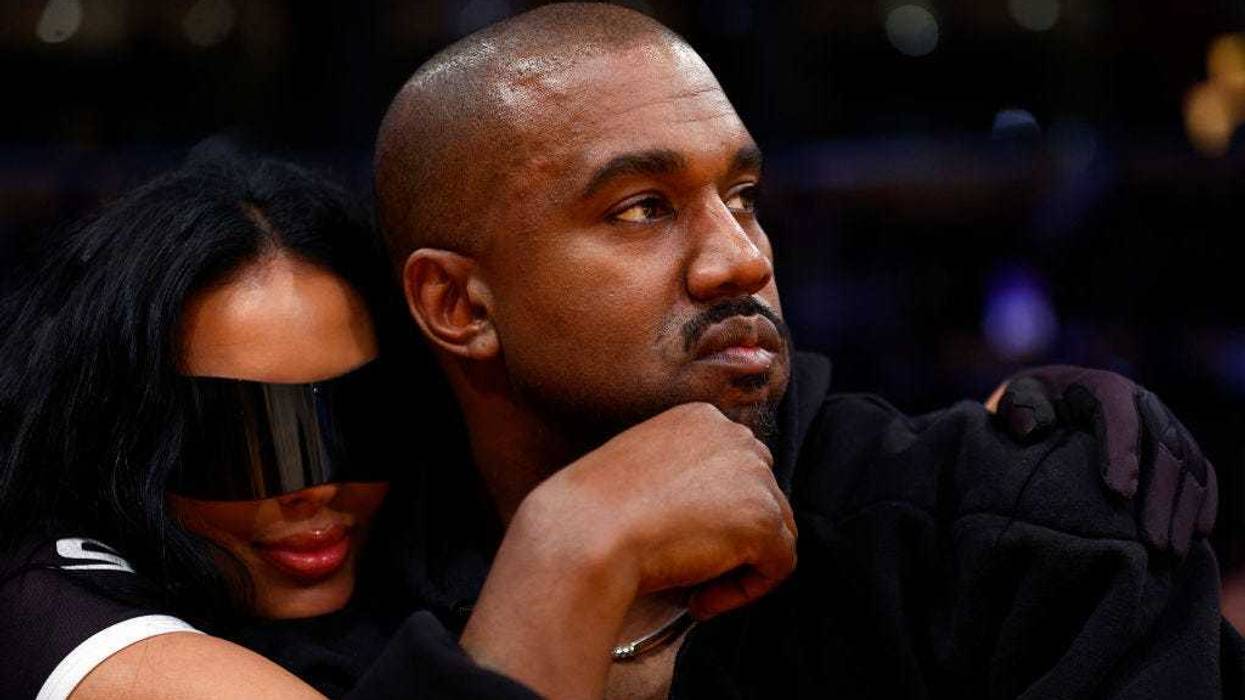 Rapper Kanye West and girlfriend Chaney Jones attend a game between the Washington Wizards and the Los Angeles Lakers in the fourth quarter at Crypto.com Arena on March 11, 2022 in Los Angeles, California.