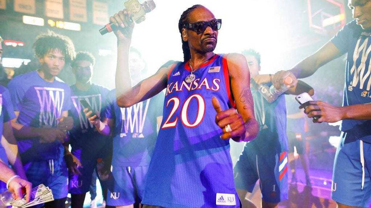rapper Snoop Dogg performs for the Allen Fieldhouse crowd during Late Night in the Phog, Kansas' annual NCAA college basketball kickoff at Allen Fieldhouse in Lawrence, Kan.