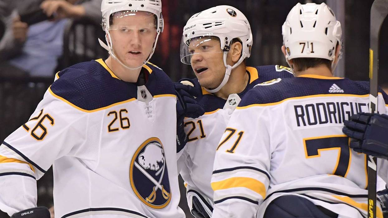 Rasmus Dahlin, Kyle Okposo and Evan Rodrigues