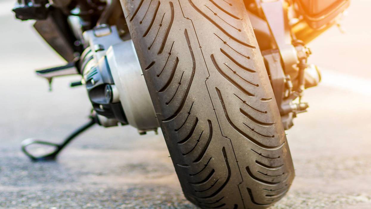Rear wheel of sports motorcycle on road