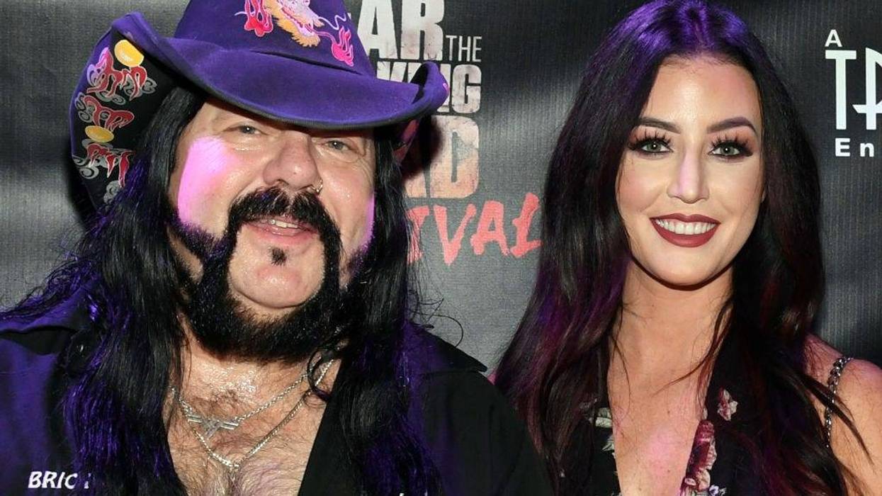Recording artist Vinnie Paul (L) and Chelsey Yeager attend the Fear the Walking Dead Survival attraction grand opening at the Fremont Street Experience on August 29, 2017 in Las Vegas, Nevada.