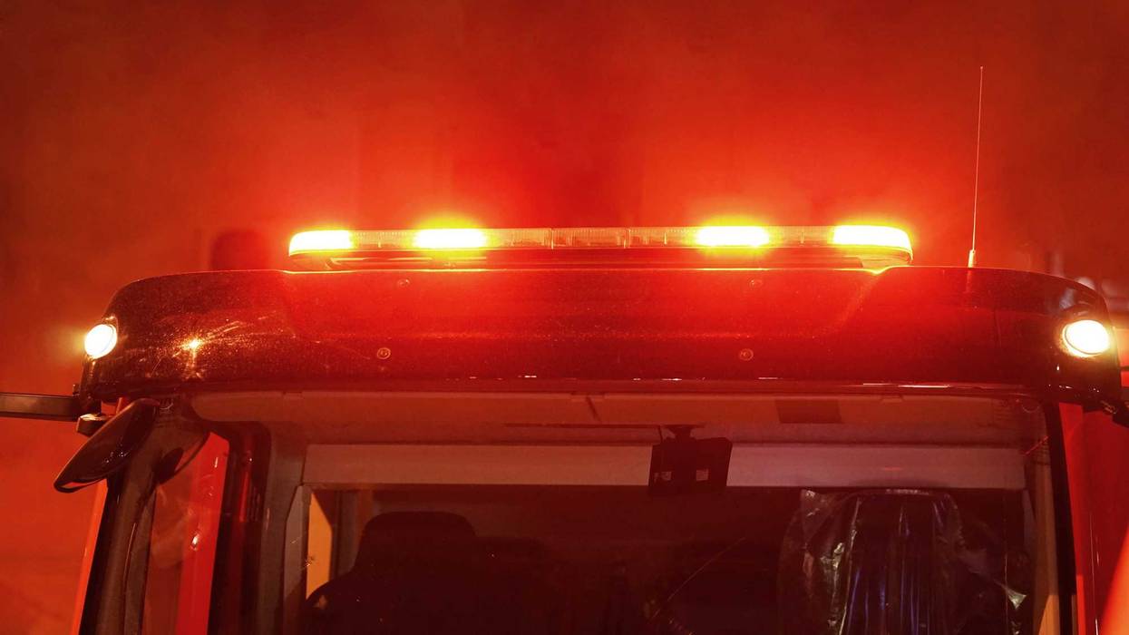 Red lights of a fire engine. Night time. Fire engine. Extinguishing the fire.