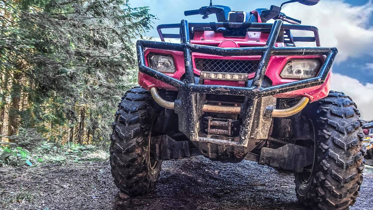 red quad bike in the forest, close-up, front view