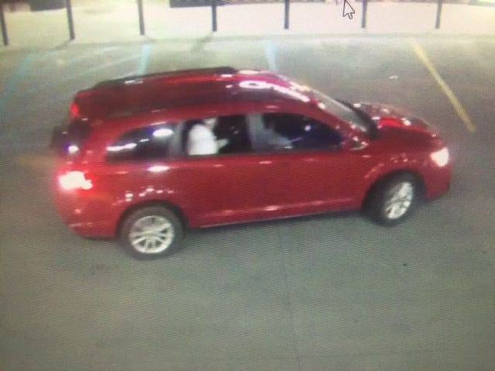 Red vehicle at scene of shooting