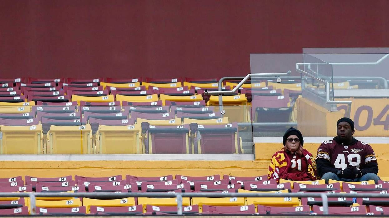 Redskins fans watch from the stands against the New York Jets