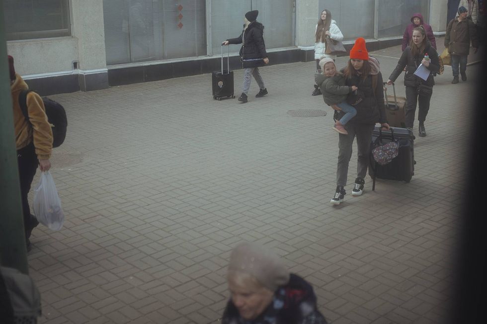 Refugees boarding train.