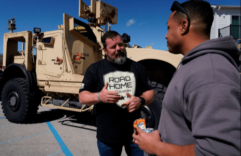 Reg McCutcheon talks to a military veteran