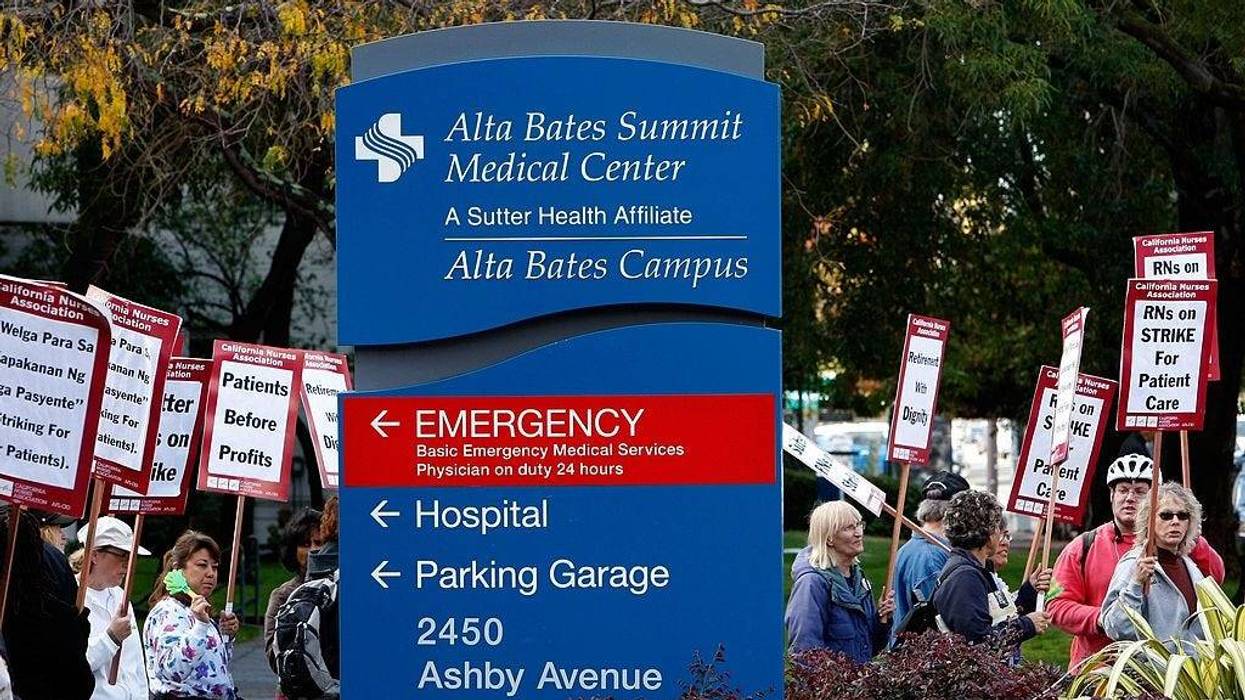 Registered nurses carry signs as they demonstrate outside of Alta Bates Medical Center October 10, 2007 in Berkeley, California.