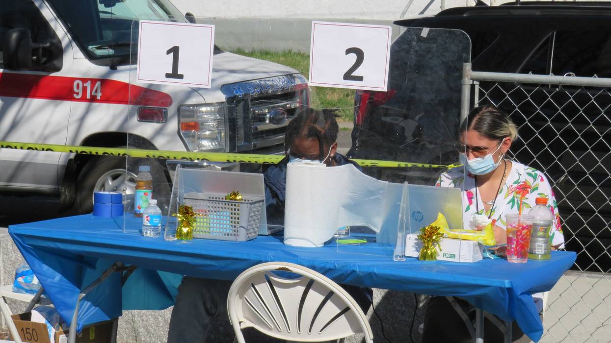 Registration table at a walk-up vaccination clinic, Hartford, 4/6/21