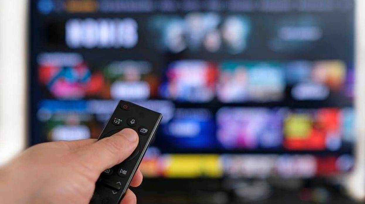 remote control in front of smart TV