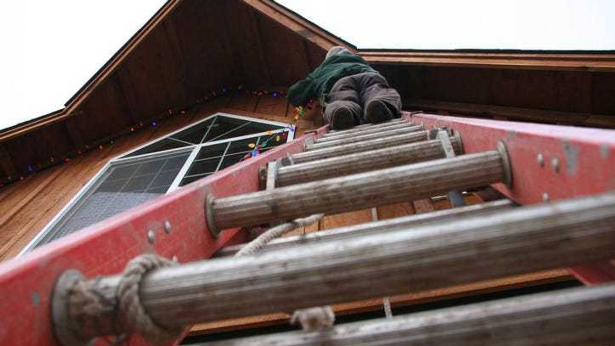 removing Christmas lights with ladder