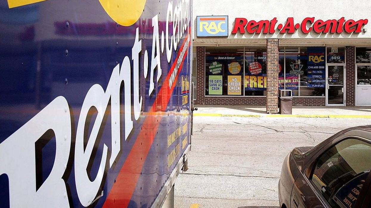 Rent-a-Center signage is seen on a truck parked outside its store September 8, 2005 in Niles, Illinois.