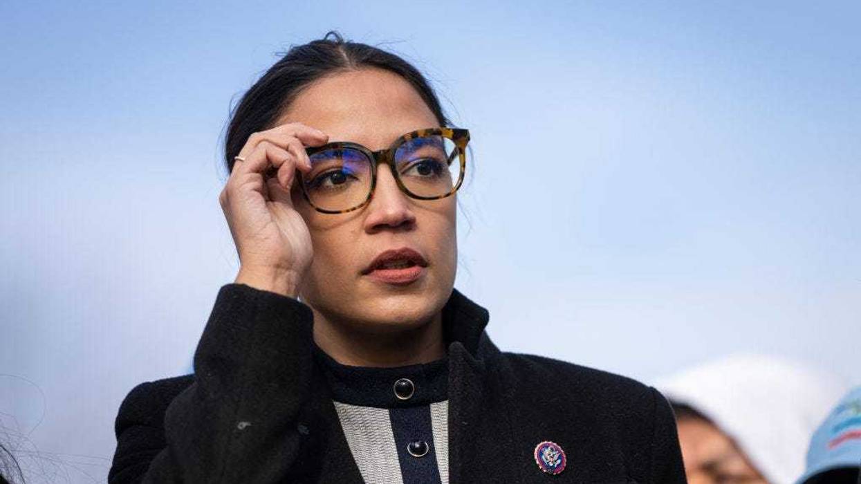 Rep. Alexandria Ocasio-Cortez (D-NY) prepares to speak during a rally for immigration provisions to be included in the Build Back Better Act outside the U.S. Capitol December 7, 2021 in Washington, DC.