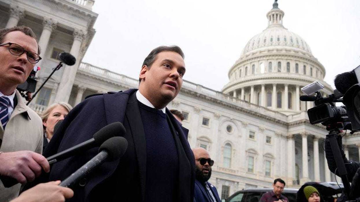 Rep. George Santos (R-NY) is surrounded by journalists as he leaves the U.S. Capitol after his fellow members of Congress voted to expel him from the House of Representatives on December 01, 2023 in Washington, DC.