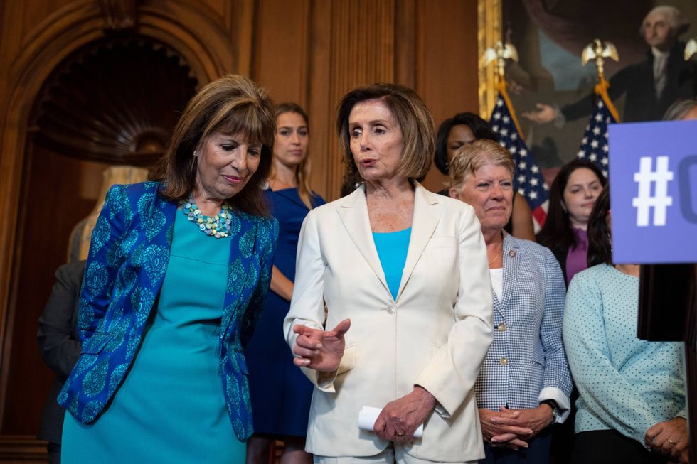 Rep. Jackie Speier (D-CA) speaks with Speaker of the House Nancy Pelosi (D-CA) during a news conference with the Democratic Women
