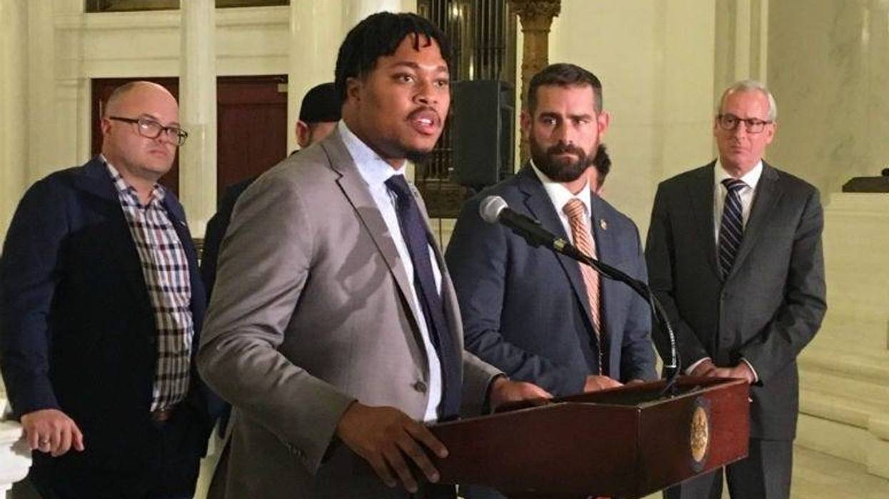 Rep. Malcolm Kenyatta speaks as Rep. Brian Sims (next to him, right) looks on at state Capitol news conference Wednesday.