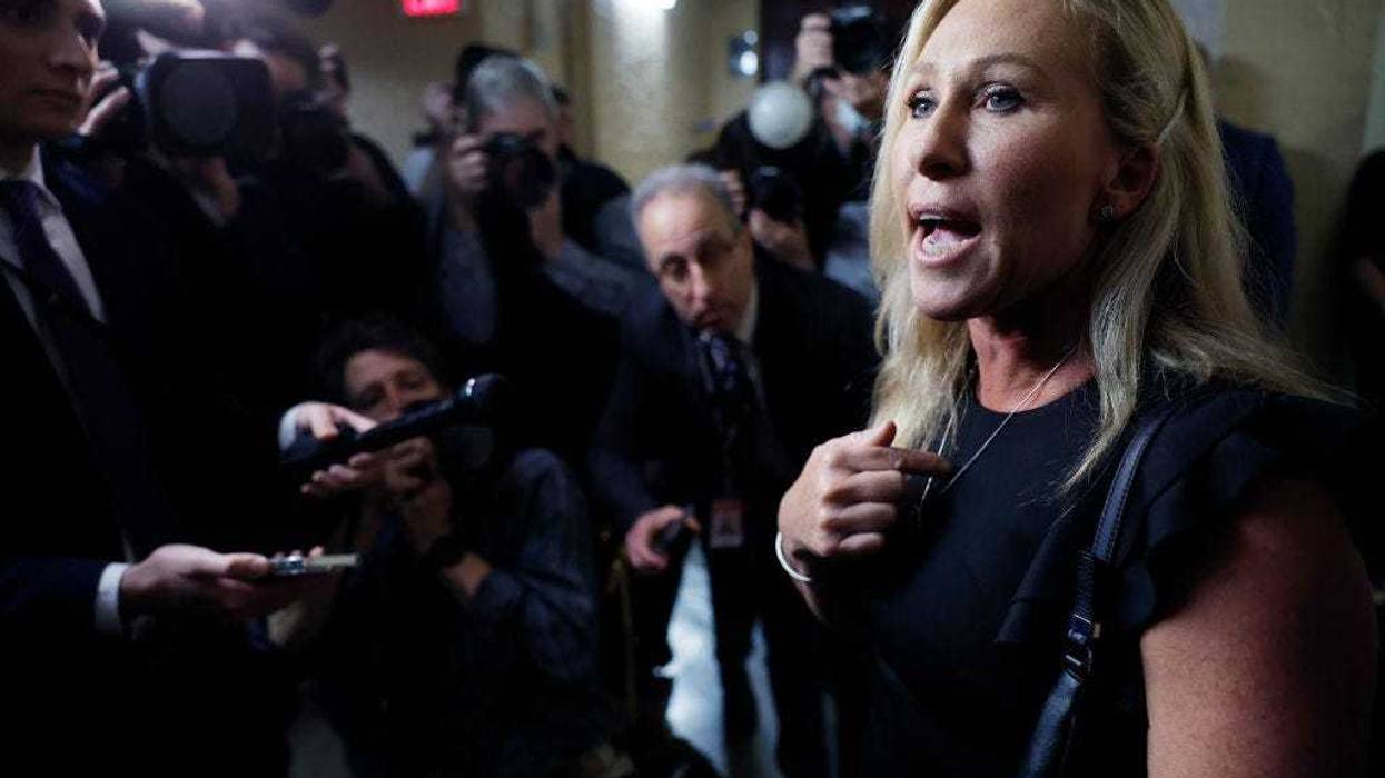 Rep. Marjorie Taylor Greene (R-GA) talks with reporters after leaving a Republican caucus meeting before the start of the 118th Congress in the basement the U.S. Capitol Building on January 03, 2023 in Washington, DC.