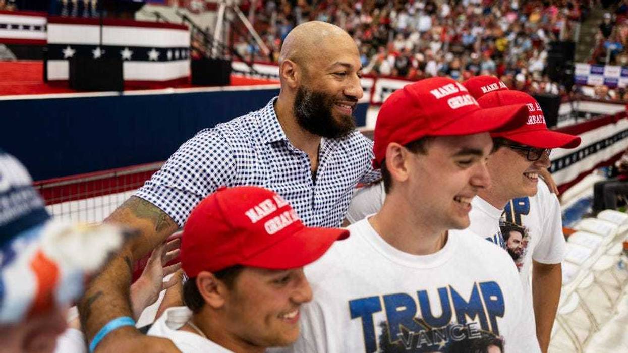 Republican candidate for Senate Royce White (C) poses for a photo before a rally featuring U.S. Republican Presidential nominee former President Donald Trump and Republican vice presidential nominee U.S. Sen. J.D. Vance (R-OH).