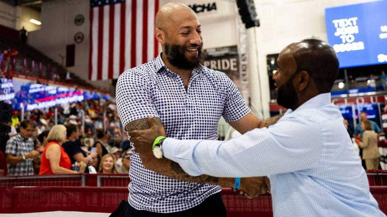 Republican candidate for Senate Royce White (L) greets attendees before a rally featuring U.S. Republican Presidential nominee former President Donald Trump and Republican vice presidential nominee U.S. Sen. J.D. Vance (R-OH) at Herb Brooks National Hockey Center on July 27, 2024 in St Cloud, Minnesota.