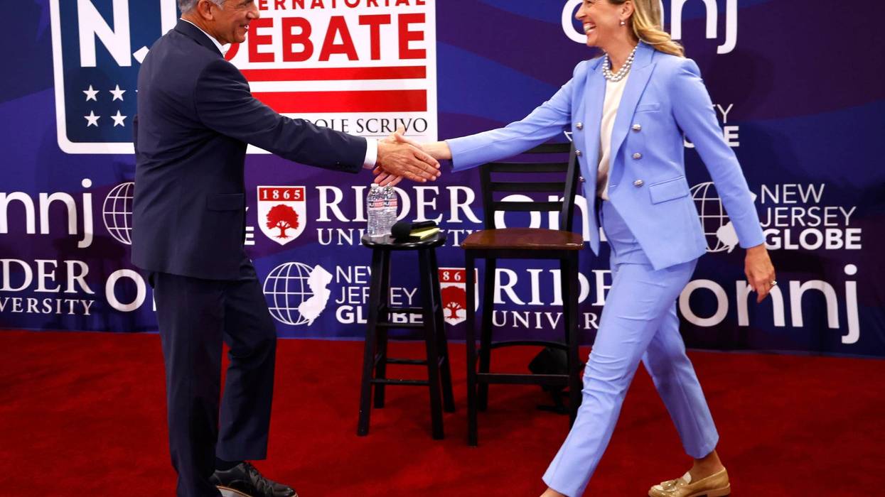 Republican candidate Jack Ciattarelli, left, shakes hands with Democratic candidate for governor Mikie Sherrill, right, before the debate on Sept. 21, 2025, in Lawrenceville, N.J.