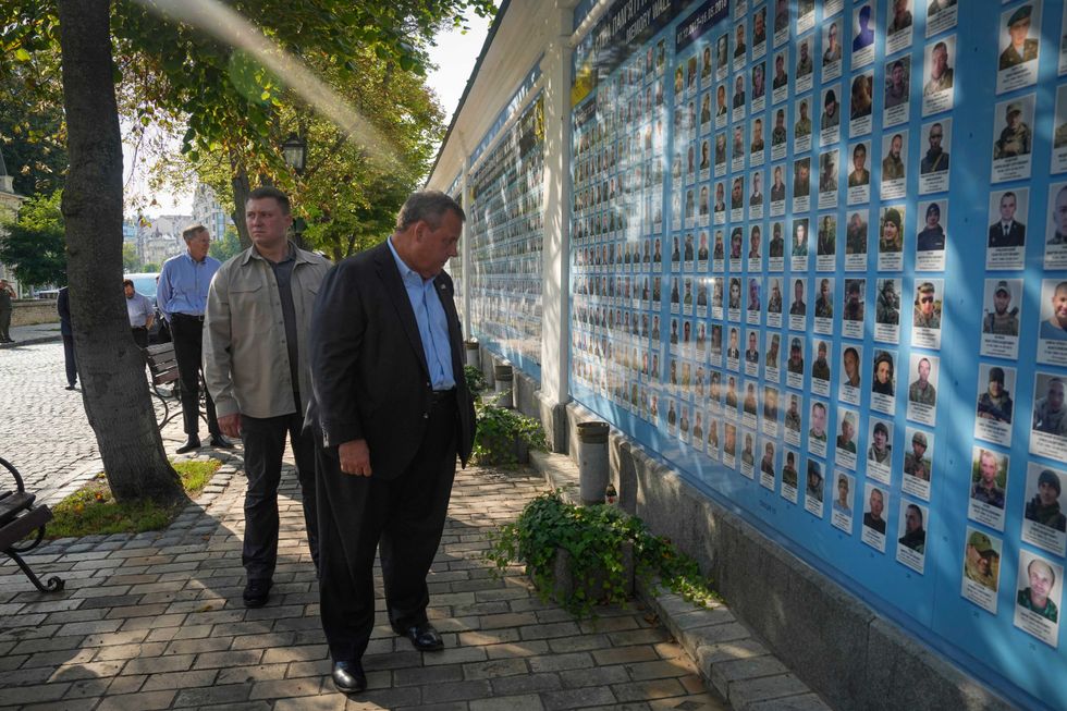Republican presidential candidate former New Jersey Gov. Chris Christie visits the Wall of Remembrance to pay tribute to killed Ukrainian soldiers, Kyiv, Ukraine, Friday, Aug. 4, 2023