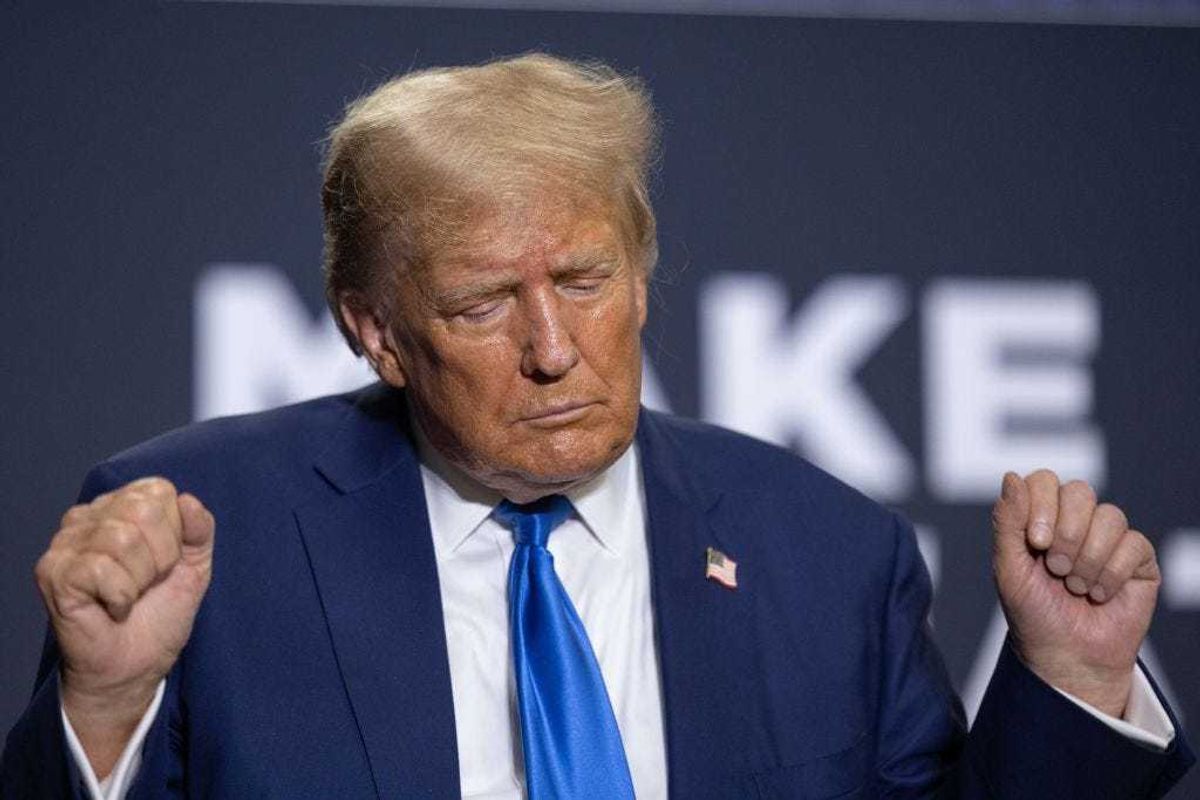 Republican presidential candidate former President Donald Trump dances on stage after delivering remarks during a campaign event on October 23, 2023 in Derry, New Hampshire. Trump officially filed for the first-in-the-nation primary on Monday at the New Hampshire State House. (Photo by Scott Eisen/Getty Images)