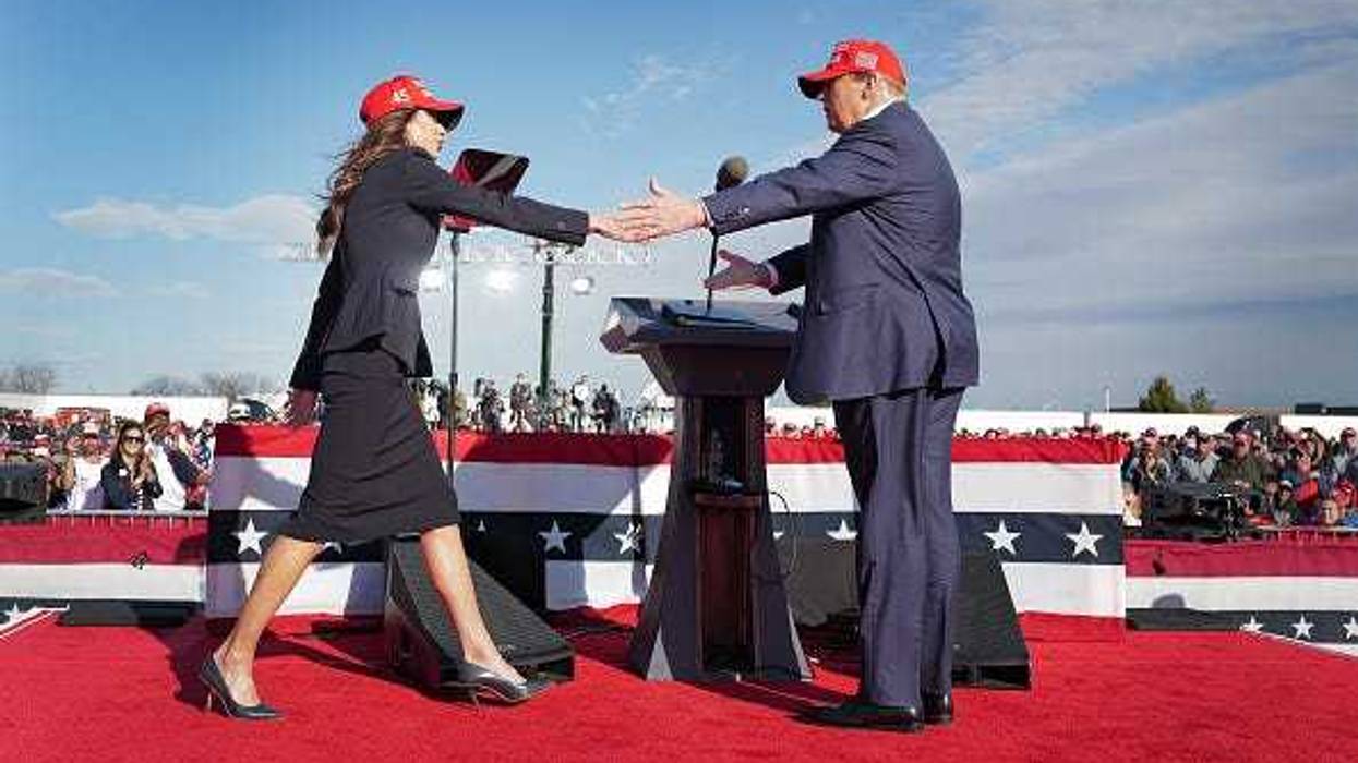 Republican presidential candidate former President Donald Trump greets South Dakota Gov. Kristi Noem during a rally at the Dayton International Airport on March 16, 2024 in Vandalia, Ohio.