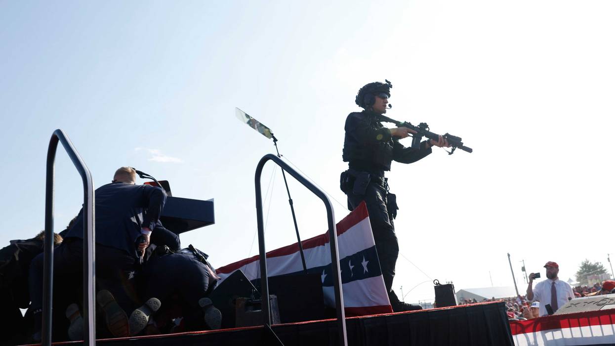 Republican presidential candidate Former President Donald Trump is rushed offstage during a rally on July 13, 2024, in Butler, Pa.