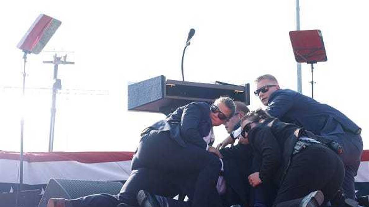 Republican presidential candidate former President Donald Trump is rushed offstage during a rally on July 13, 2024 in Butler, Pennsylvania.