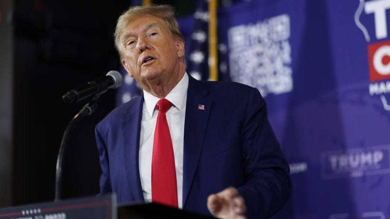 Republican presidential candidate former President Donald Trump speaks at a commit to caucus campaign event at the Whiskey River bar on December 02, 2023 in Ankeny, Iowa.