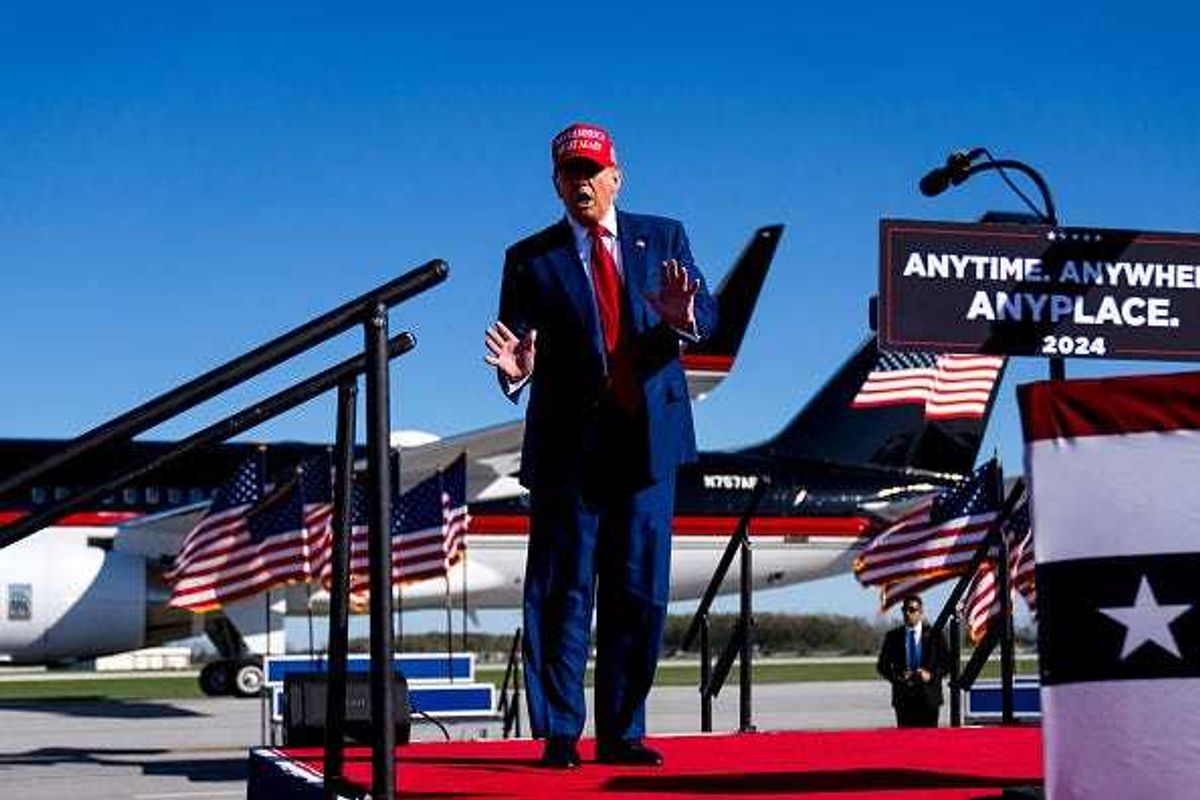 Republican presidential candidate, former U.S. President Donald Trump dances during a rally on May 1, 2024 at Avflight Saginaw in Freeland, Michigan.