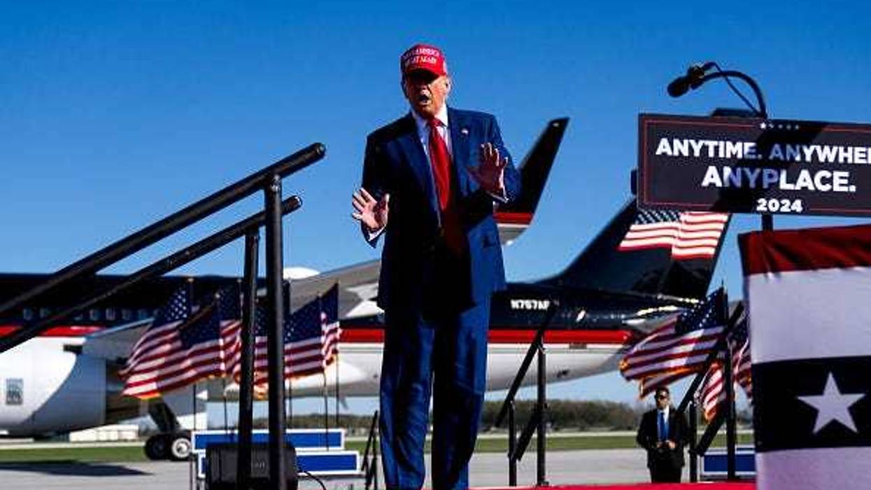Republican presidential candidate, former U.S. President Donald Trump dances during a rally on May 1, 2024 at Avflight Saginaw in Freeland, Michigan.