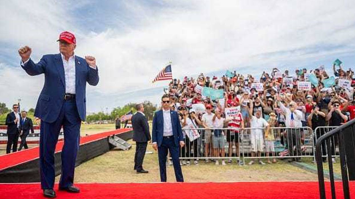 Republican presidential candidate, former U.S. President Donald Trump dances upon arrival at his campaign rally at Sunset Park on June 09, 2024 in Las Vegas, Nevada.