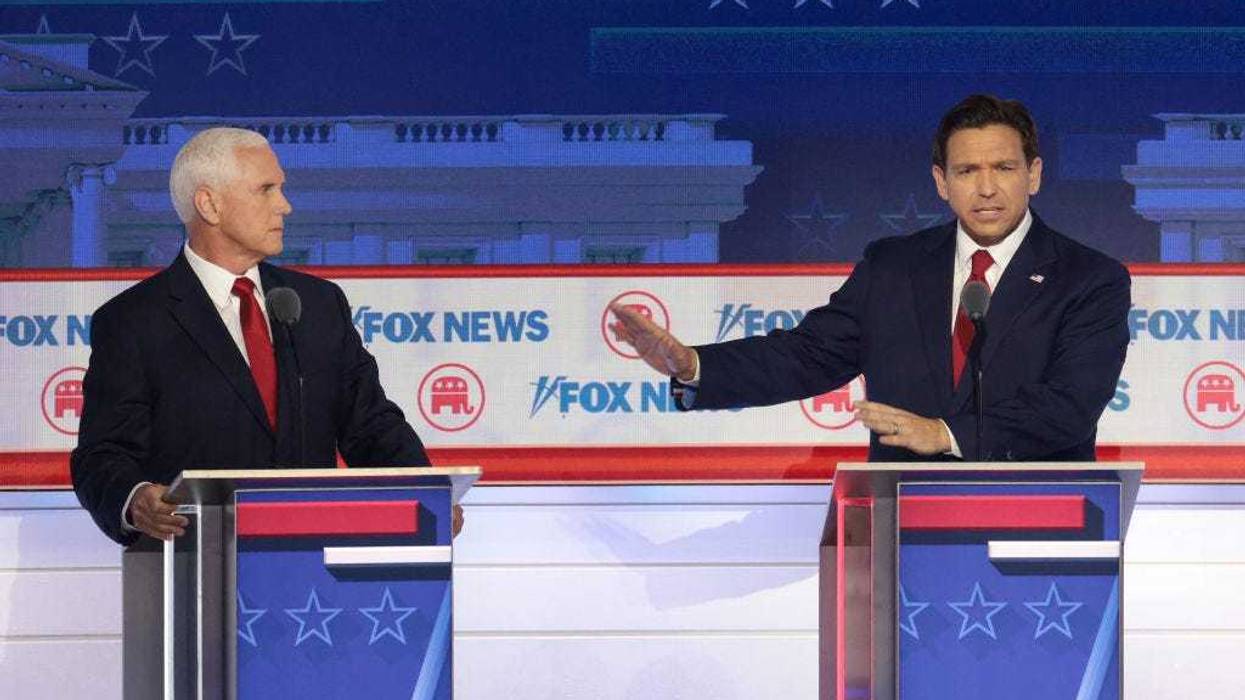 Republican presidential candidates (L-R), former U.S. Vice President Mike Pence and Florida Gov. Ron DeSantis participate in the first debate of the GOP primary season hosted by FOX News at the Fiserv Forum on August 23, 2023 in Milwaukee, Wisconsin. Eight presidential hopefuls squared off in the first Republican debate as former U.S. President Donald Trump, currently facing indictments in four locations, declined to participate in the event. (Photo by Win McNamee/Getty Images)