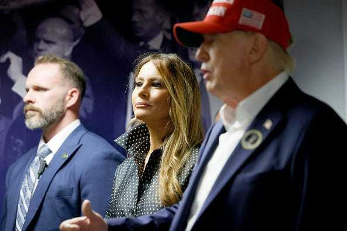 Republican presidential nominee former President Donald Trump thanks his staff at his campaign headquarters as wife Melania Trump looks on, November 05, 2024 in West Palm Beach, Florida.