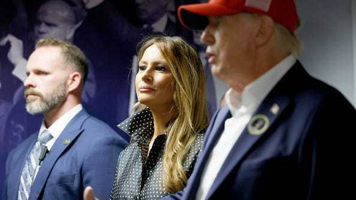 Republican presidential nominee former President Donald Trump thanks his staff at his campaign headquarters as wife Melania Trump looks on, November 05, 2024 in West Palm Beach, Florida.