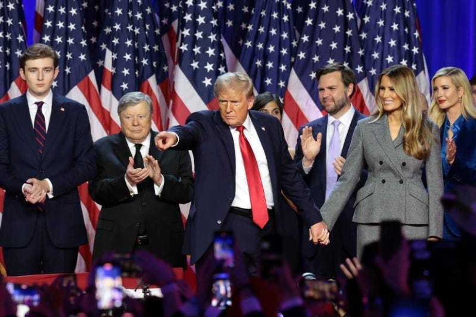 Republican presidential nominee, former U.S. President Donald Trump gestures on stage during an election night event at the Palm Beach Convention Center on November 06, 2024 in West Palm Beach, Florida.