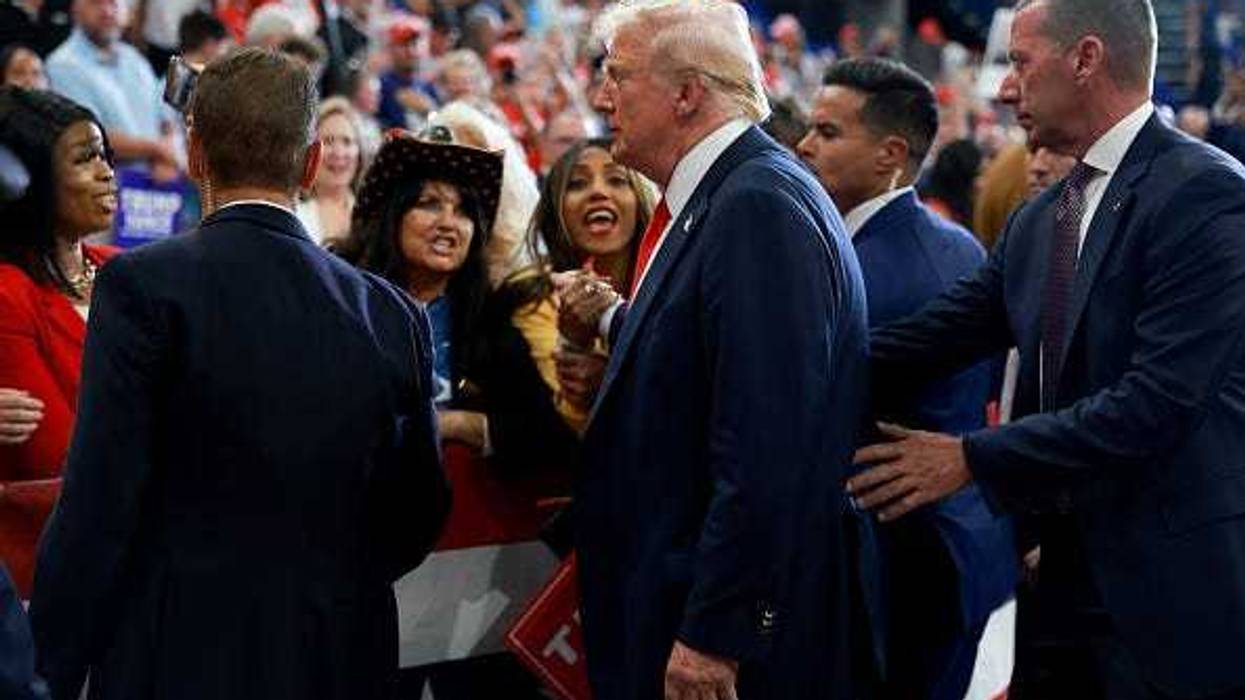 Republican presidential nominee, former U.S. President Donald Trump greets supporters after holding a campaign rally at the Georgia State University Convocation Center on August 03, 2024 in Atlanta, Georgia.