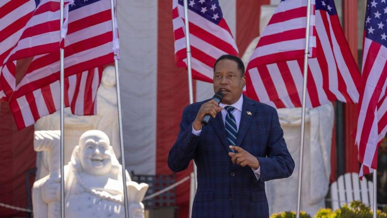 Republican recall candidate Larry Elder addresses the "Asian Rally for Yes on Recall" at the Asian Garden Mall on Sept. 4, 2021, in Westminster, California. Actress Rose McGowan endorsed Elder on Sunday and alleged that Gov. Gavin Newsom's wife tried to cover up her allegations of sexual assault against Harvey Weinstein.
