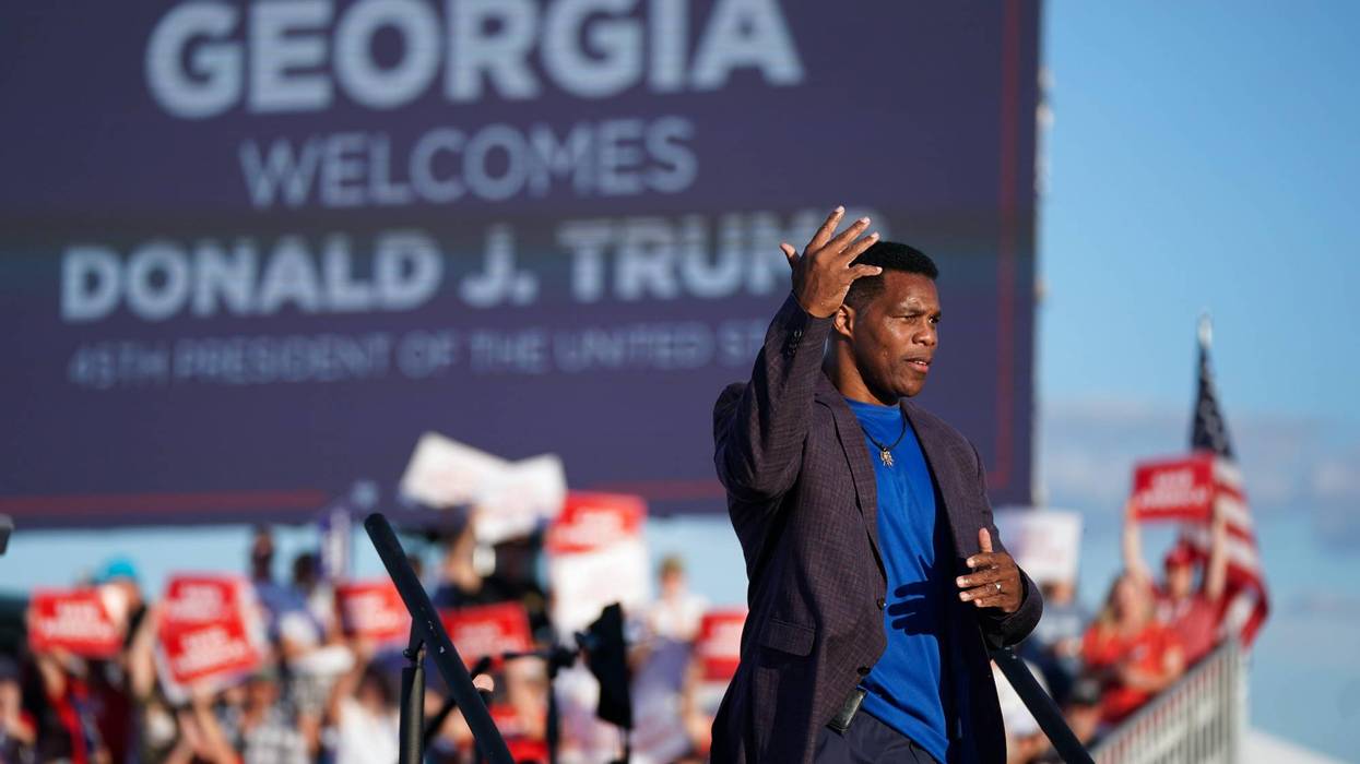 Republican Senate candidate Herschel Walker walks off the stage during a rally featuring former US President Donald Trump on September 25, 2021 in Perry, Georgia.