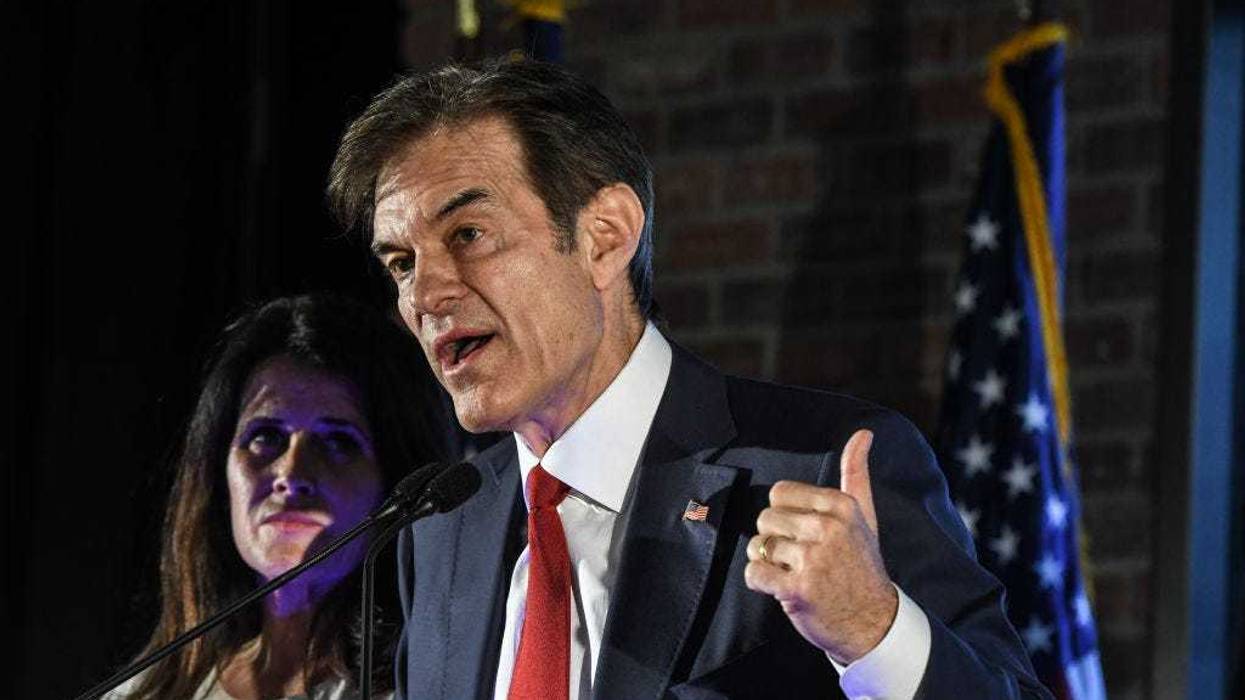 Republican U.S. Senate candidate Mehmet Oz greets supporters after the primary race resulted in an automatic re-count due to close results on May 17, 2022 in Newtown, Pennsylvania. Television personality Oz, endorsed by former President Donald Trump, finished in a virtual dead heat with former George W. Bush administration official Dave McCormick with 95 percent of the vote reported. (Photo by Stephanie Keith/Getty Images)