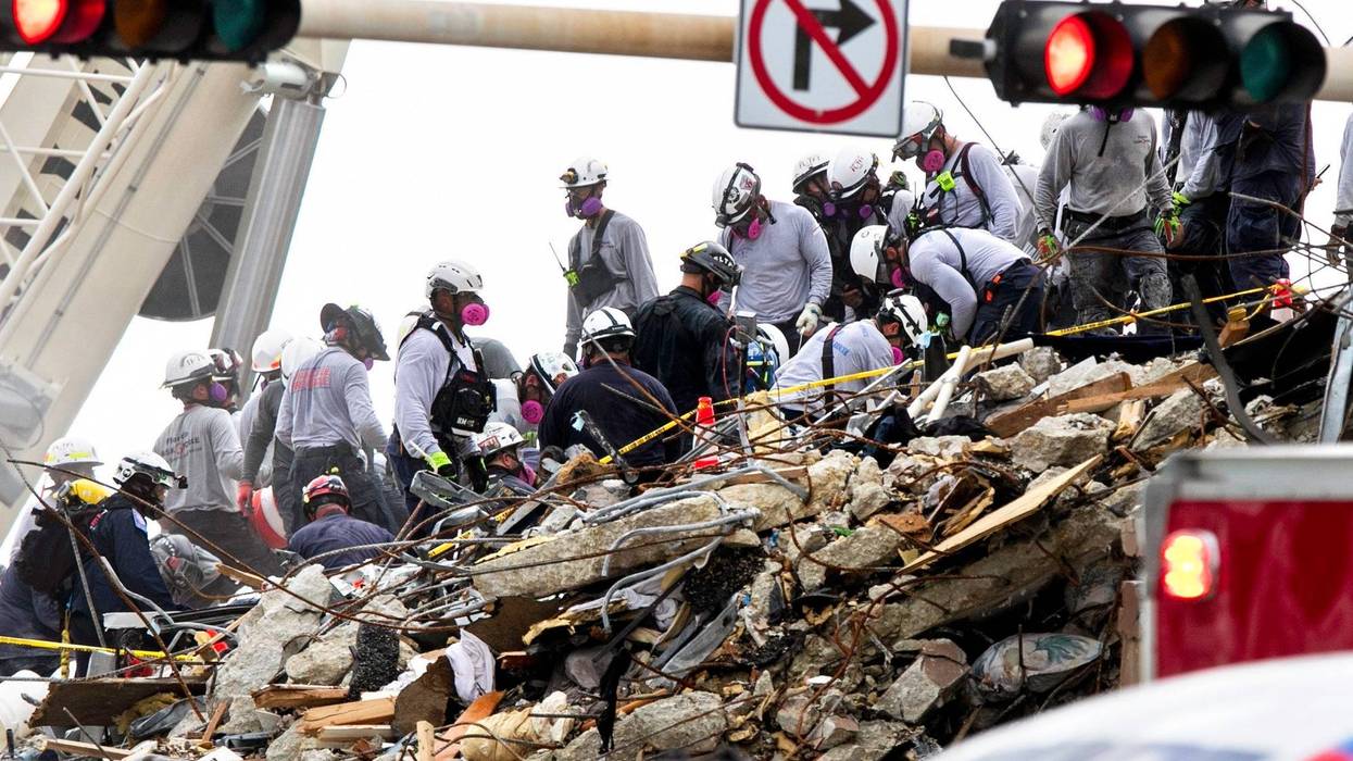 Rescue workers at the Surfside, Fla., condominium collapse site.