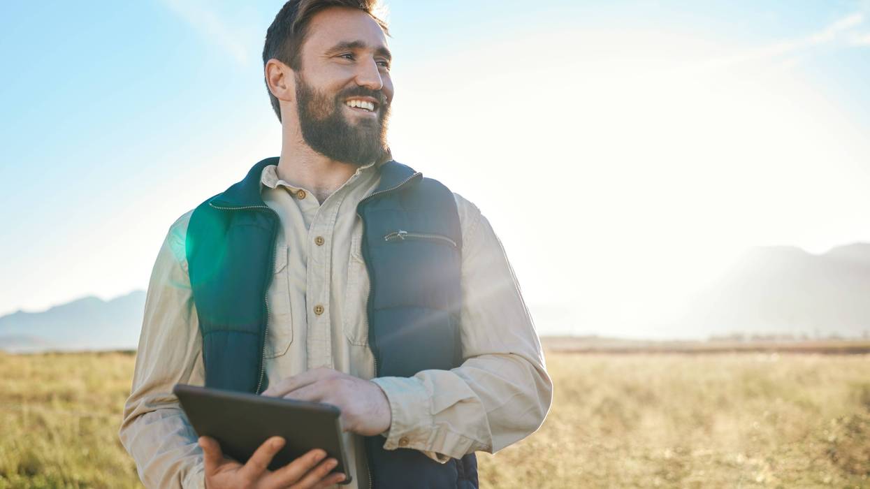 Research or agriculture man on tablet on farm