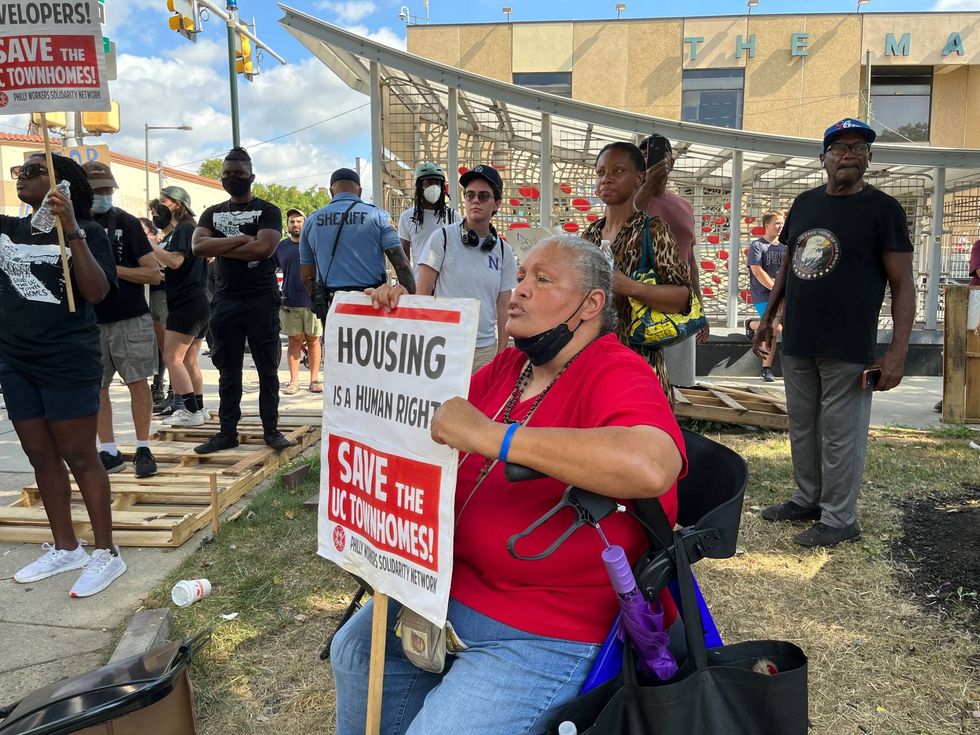 Resident Maria Lyles, who has lived in University City Townhomes for 25 years, watched from a distance as Philadelphia sheriff