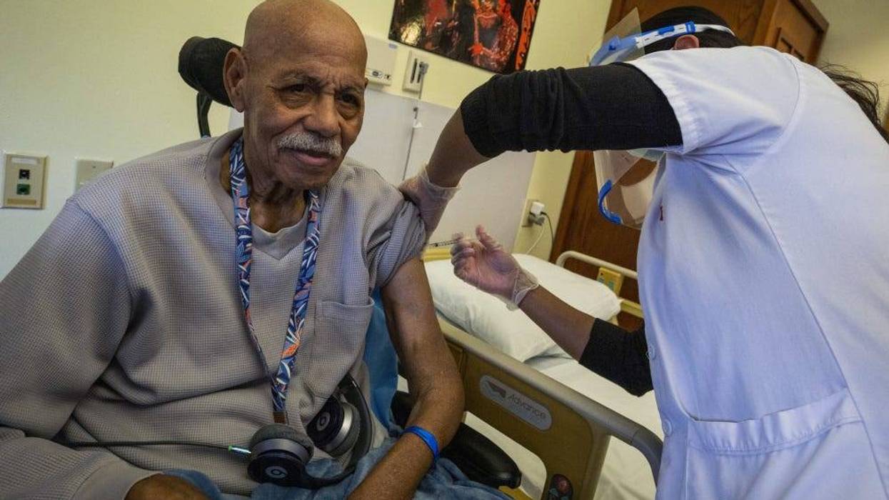 Resident Robert Goines receives the COVID-19 vaccination at the New Jersey Veterans Memorial Home at Menlo Park, Edison, N.J., Jan. 5, 2021. These are the first vaccinations administered at the Home under the Federal Pharmacy Program.