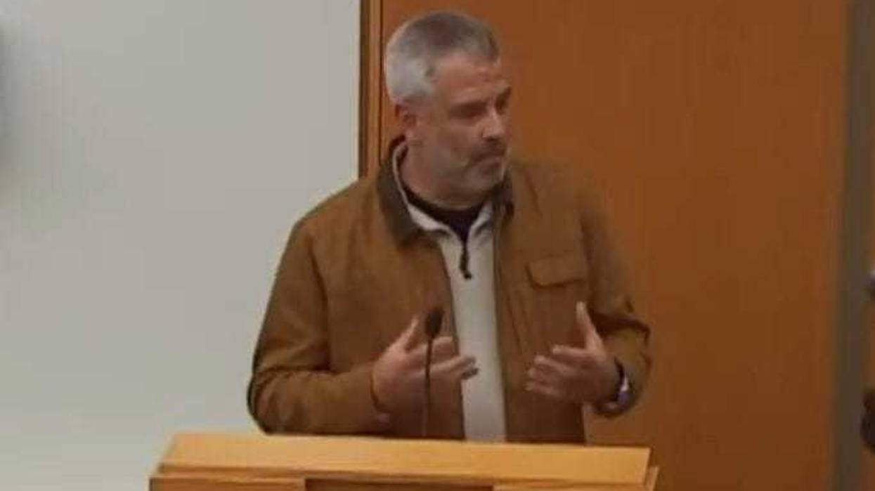 resident speaking at school board meeting