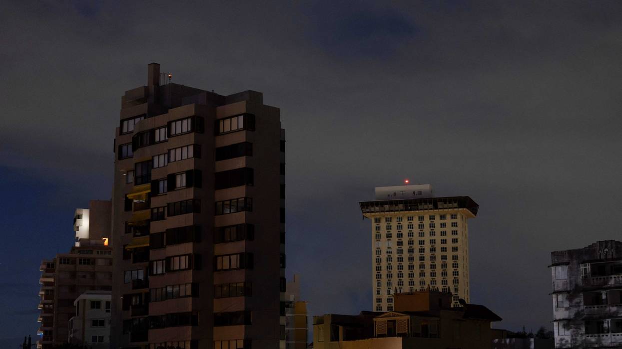 Residential buildings are seen in the dark in San Juan, Puerto Rico after a major power outage hit the island on December 31, 2024