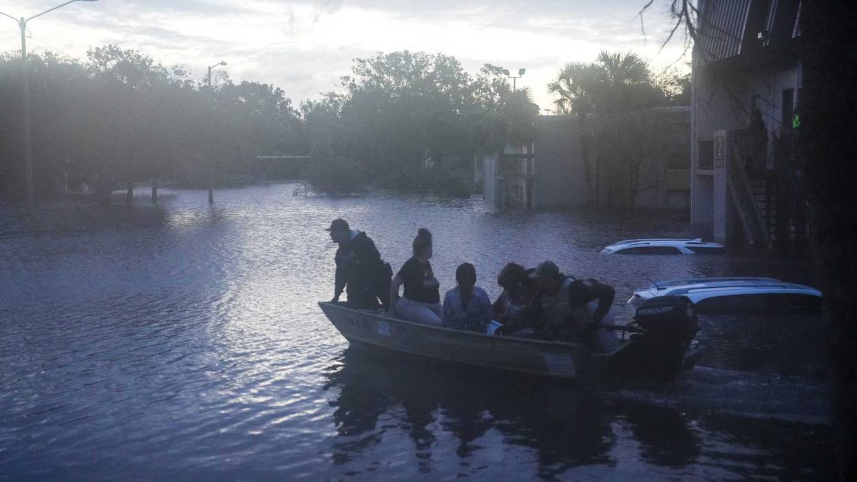 Residents are rescued from an apartment complex in Clearwater that was flooded from and overflowing creek due to Hurricane Milton on October 10, 2024 in Florida