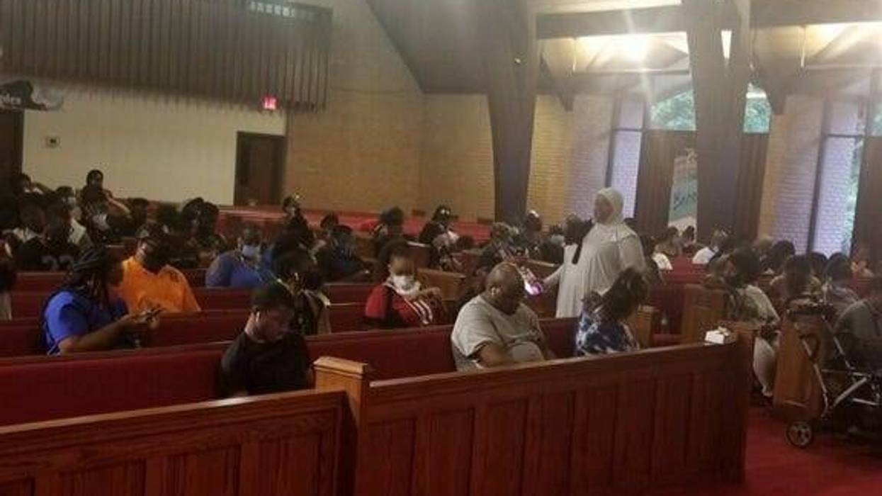 Residents hoping to cast ballots wait inside New Life Presbyterian Church in Atlanta Tuesday